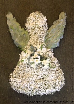 <h2>Angel Tribute | Funeral Flowers</h2>
<ul>
<li>Approximate Size 70cm x 50cm</li>
<li>Hand created white Angel in fresh flowers and foliages</li>
<li>To give you the best we may occasionally need to make substitutes</li>
<li>Funeral Flowers will be delivered at least 2 hours before the funeral</li>
<li>For delivery area coverage see below</li>
</ul>
<br>
<h2>Liverpool Flower Delivery</h2>
<p>We have a wide selection of Bespoke Funeral Tributes offered for Liverpool Flower Delivery. Bespoke Funeral Tributes can be provided for you in Liverpool, Merseyside and we can organize Funeral flower deliveries for you nationwide. Funeral Flowers can be delivered to the Funeral directors or a house address. They can not be delivered to the crematorium or the church.</p>
<br>
<h2>Flower Delivery Coverage</h2>
<p>Our shop delivers funeral flowers to the following Liverpool postcodes L1 L2 L3 L4 L5 L6 L7 L8 L11 L12 L13 L14 L15 L16 L17 L18 L19 L24 L25 L26 L27 L36 L70 If your order is for an area outside of these we can organise delivery for you through our network of florists. We will ask them to make as close as possible to the image but because of the difference in stock and sundry items it may not be exact.</p>
<br>
<h2>Liverpool Funeral Flowers | Bespoke Tributes</h2>
<p>This White Angel Funeral Tribute has been loving handcrafted by our expert florists and comes complete with wings made from fresh flowers. Can be customised to have any colour spray flowers. This example has been made with white gypsophila a spray of white freesia and soft leaves to create the delicate wing shapes.</p>
<br>
<p>Bespoke Funeral Tributes are a way to create a tribute that is truly unique and specially designed for a loved one.</p>
<br>
<p>These are sometimes selected by family members as the main tribute or more often a group of friends or workplace colleagues as a symbol of things they associate with the deceased.</p>
<br>
<p>The flowers are arranged in floral foam, which means the flowers have a water source so they look their very best for the day.</p>
<br>
<p>Containing gypsophila, white freesia, stachys byzantine (lambs ears) and mixed seasonal foliages.</p>
<br>
<h2>Best Florist in Liverpool</h2>
<p>Trust Award-winning Liverpool Florist, Booker Flowers and Gifts, to deliver funeral flowers fitting for the occasion delivered in Liverpool, Merseyside and beyond. Our funeral flowers are handcrafted by our team of professional fully qualified who not only lovingly hand make our designs but hand-deliver them, ensuring all our customers are delighted with their flowers. Booker Flowers and Gifts your local Liverpool Flower shop.</p>
<br>
<p><em>Debera G - 5 Star Review on yell.com - Funeral Florist Liverpool</em></p>
<br>
<p><em>Fleur and her team made the flowers for my Dad's funeral. I knew I wanted something quite specific but was quite unsure how to execute the idea. Fleur understood immediately what I was hoping to achieve and developed the ideas into amazingly beautiful flowers that were just perfect. I honestly can't recommend her highly enough - she created something outstanding and unique for my Dad. Thanks Fleur.</em></p>
